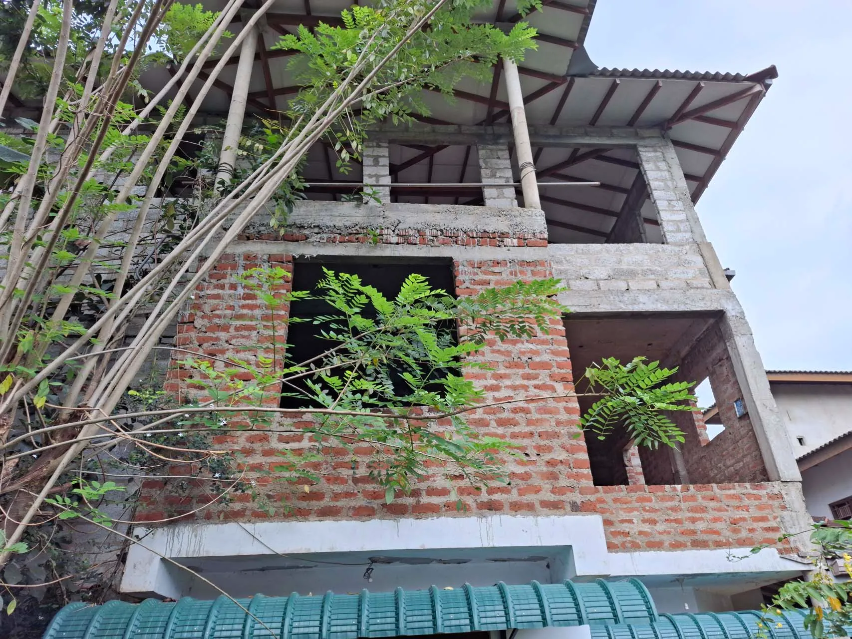 Covered entrance beside the usable ground floor