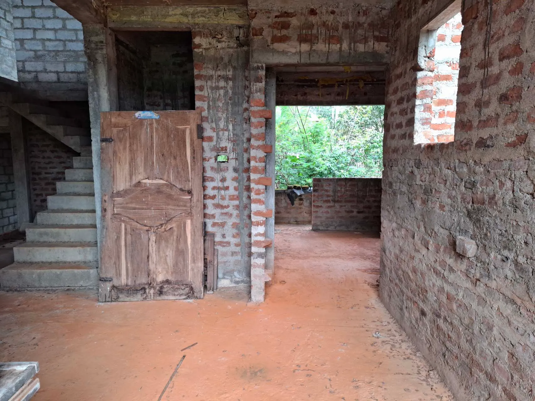 Unfinished second-floor bathroom and bedroom spaces