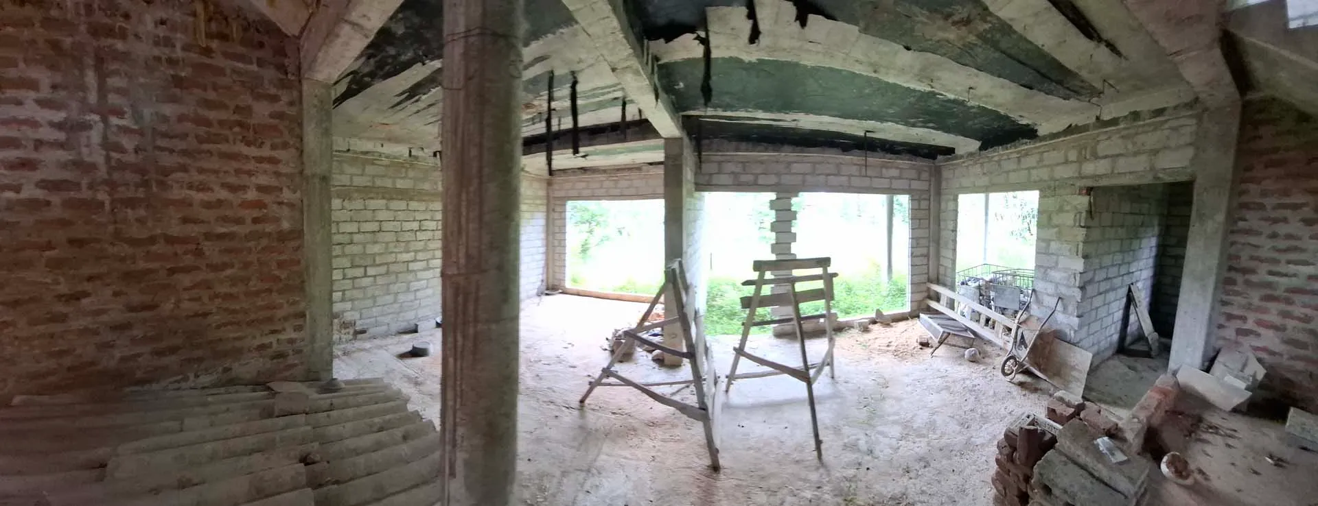 Wide panoramic view across the unfinished second floor