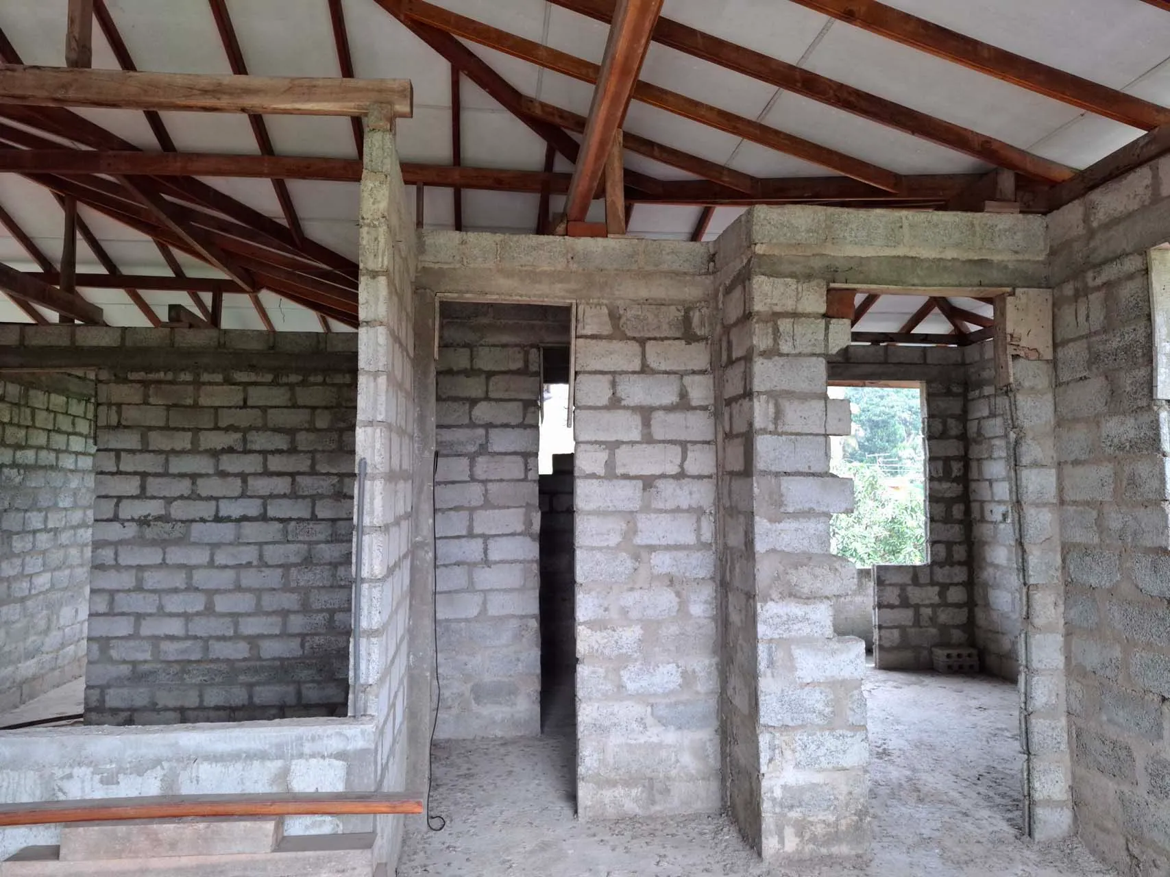 Unfinished bathroom and room spaces on the top floor