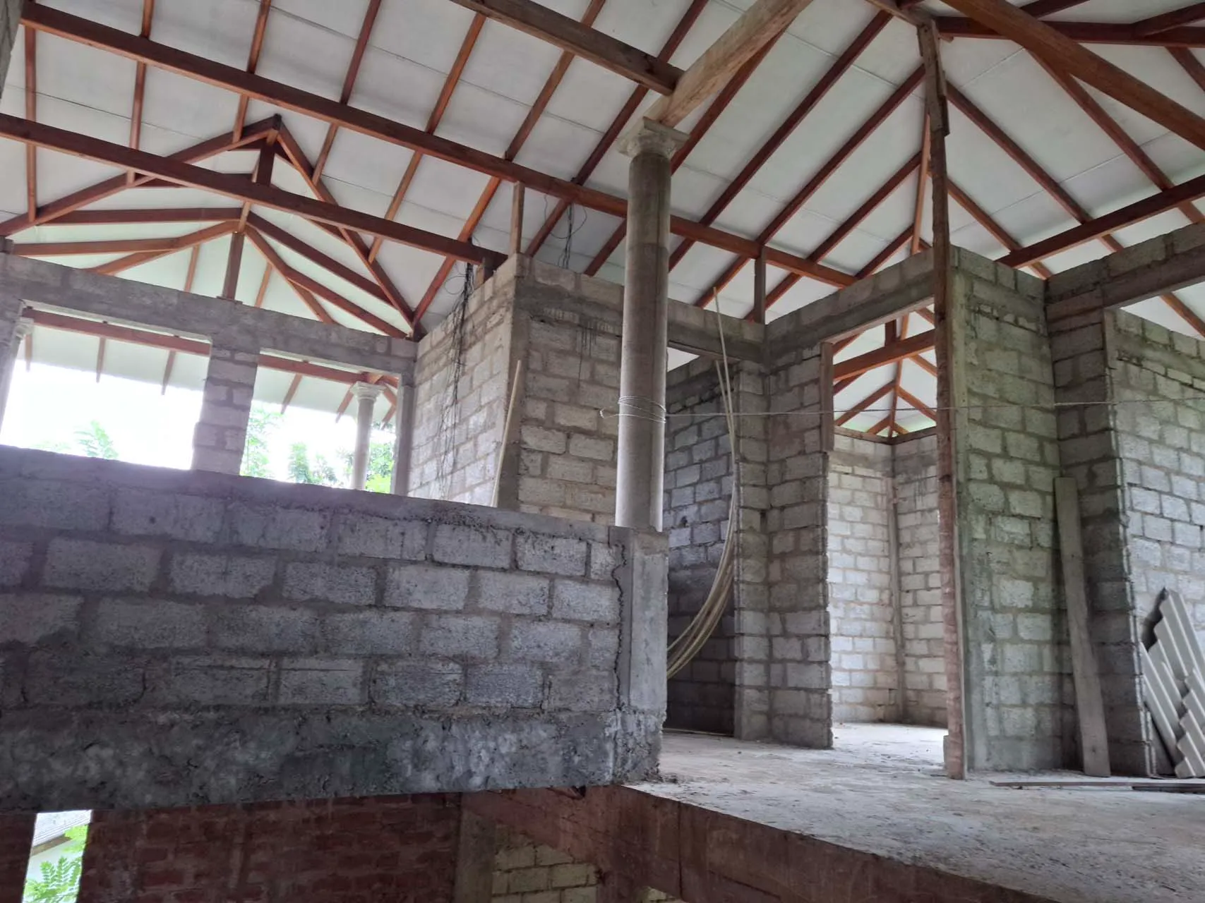 Top-floor space viewed from the concrete stairs